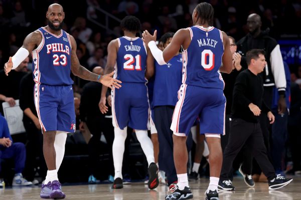 76ers win in LeBron James' debut, spoil Knicks' ring night